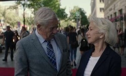 Movie image from Betty and Roy emerge from Hotel Adlon Kempinski